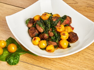 Gehaktballetjes met gekonfijte tomaten en jonge spinazie